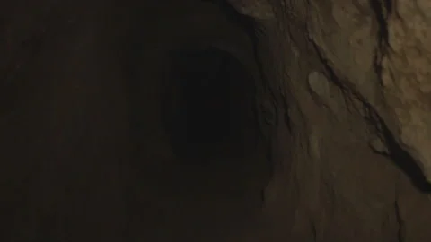 Handheld Cave Walking, dark, flashlight, Cavern Stock Footage 252354703