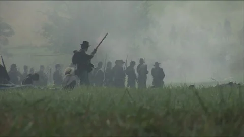 Handheld Civil War  "Combat Camera" on the U.S. Firing line - Battle reenactment Stock Footage 184449043