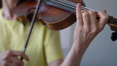 Handheld Close-up of Female Hands Playing Violin.  Finger Strike in violin. Stock Footage 155108338