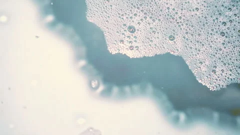 Handheld close-up of foam on water Stock Footage 331840282