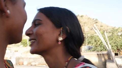 Handheld close up gimbal stabilized close up two shot pan down and up of two Stock Footage 92718922