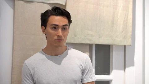 Handheld close-up of handsome man at store Stock-Footage 114849686