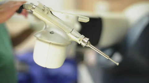 Handheld Close up shot of a doctor testing a non-invasive robotic machine Stock Footage 130211324