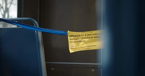 Handheld close-up shot inside train with warning to keep away from driver, Video stock 128719500
