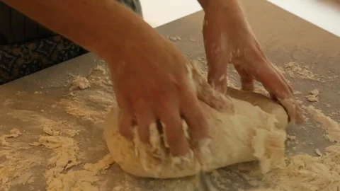 Handheld close-up shot of a man kneading dough Video stock 114846733