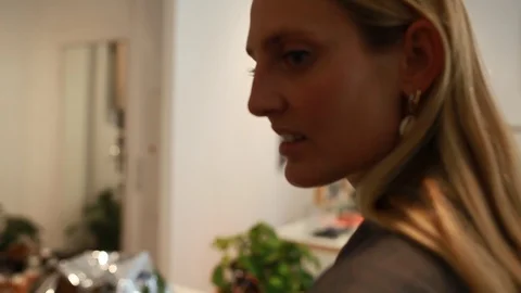 Handheld close-up shot of a woman checking out sunglasses Vídeo Stock 114886076