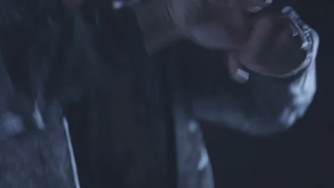 Handheld close up shot of young islamic boy dancing with hands during night Stock Footage 211869657