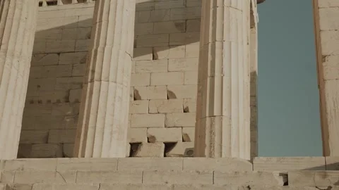 Handheld Close-Up of Sunlit Columns Inside Acropolis of Athens Monument, Greece Stock Footage 342063058