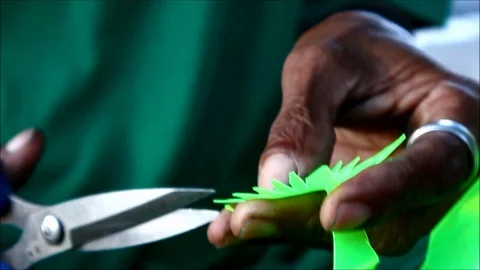 Handheld close up video of hand of man making a home decor made out of Video stock 123781683