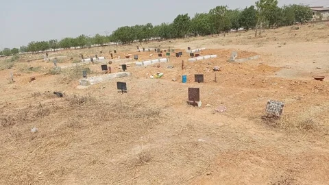 Handheld Close View Of Graves In Graveyard Kano Nigeria Vídeo Stock 331069261
