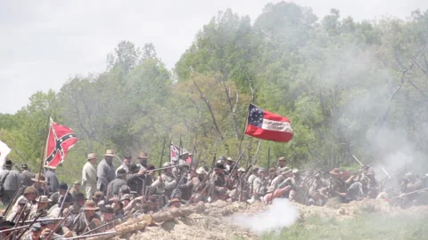 Handheld "Combat Camera" with a Confederate Firing line - Civil War reenactment Stock Footage 148352833