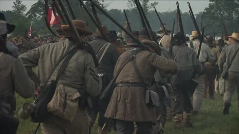 Handheld "Combat Camera" - Confederates marching into a Civil War Reenactment Stock Footage 183879737