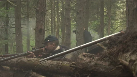 Handheld "Combat Camera" down a Union Firing line - Civil War Battle reenactment Stock Footage 183722133