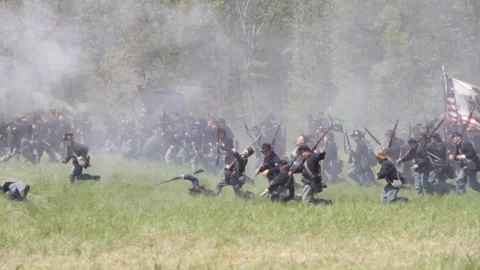Handheld "Combat Camera" with a Union Firing line - Civil War Battle reenactment Stock Footage 148359152