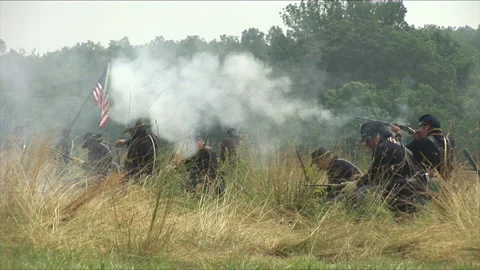 Handheld "Combat Camera" with a Union Firing line - Civil War Battle reenactment Stock Footage 180256480