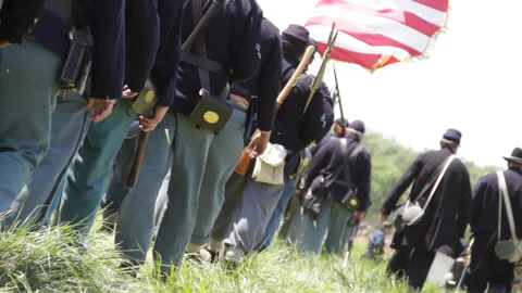 Handheld "Combat Camera" with a Union Soldiers marching - Civil War reenactment Stock Footage 148358349