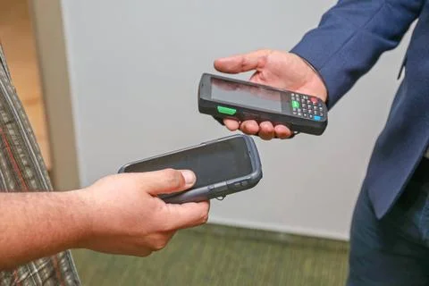 Handheld Computers Two Man Holding Portable Computer Devices Equipment Cop... 写真素材