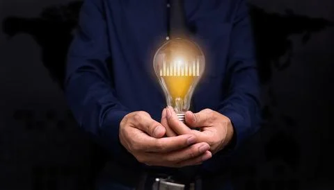 Handheld concept light bulb bar graph idea stock investment Stock Photos