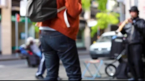 Handheld dancing sax busker street tourist denim Stock Footage 94797982
