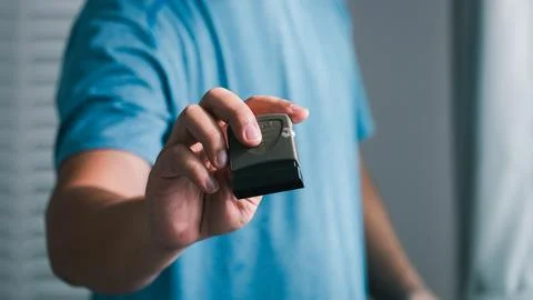 Handheld device showcase user's hand indoor setting technology presentation.. Stock Photos