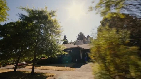 Handheld Driving Looking Out Window Passing Houses Homes Travel Car Vídeo Stock 128916621