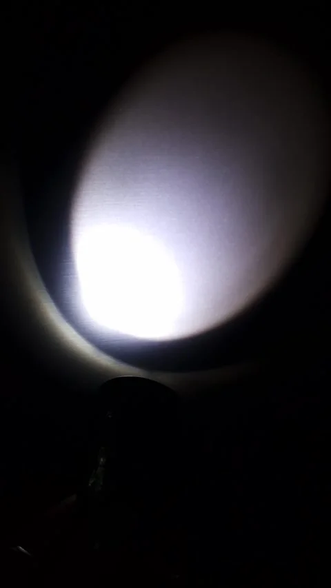 Handheld Flashlight Illuminating A Dark Metal Surface Stock-Footage 325224022