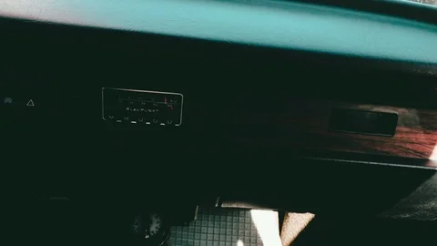 Handheld footage of the interior of a -1974 VW Beetle going from the right to Stock Footage