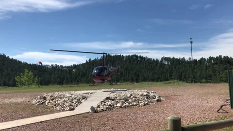 Handheld Footage of Small Helicopter Taking Off on Sunny Day Stock Footage 277124758