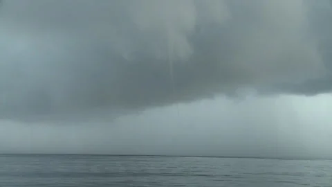 Handheld long shot of a storm brewing Stock Footage 310540076