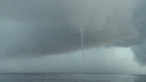 Handheld long shot of a storm creating a cyclone Stock Footage 310540074