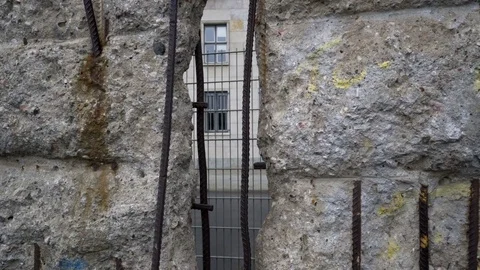 Handheld Looking Through Hole in Berlin Wall Stock Footage 75261930