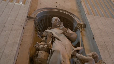 Handheld Low-Angle Pan of Marble Saint Statue in St. Peter’s Basilica Stock Footage 320137170