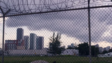Handheld Low Angle Shot Suburban Fence - Filmed Red Scarlet 4k Video stock 86411469