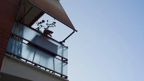 Handheld Low-Angle Still of Residential Balcony with Green Potted Plant Stock Footage 315815448