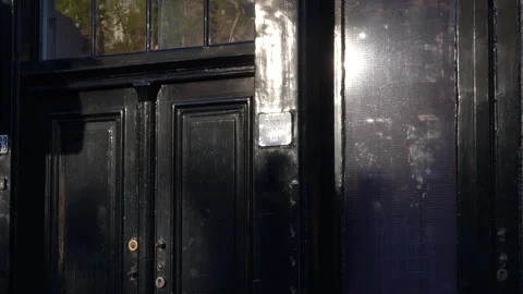 Handheld medium of Anne Frank House as people pass by the front Vidéo 250763562