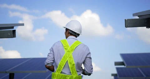 Handheld medium shot, rear view of Asian young inspector engineer man wearing Stock-Footage 224232797
