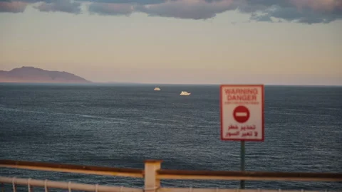 Handheld medium shot of Red Sea from an observation site on top of the cliff. Stock Footage 331158253