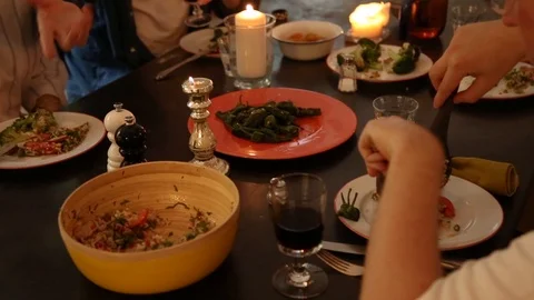 Handheld mid section shot of a friend serving meal in a plate Video stock 114846687
