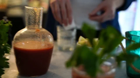 Handheld mid section shot of a man pouring drink in the glass Stock Footage 114884596