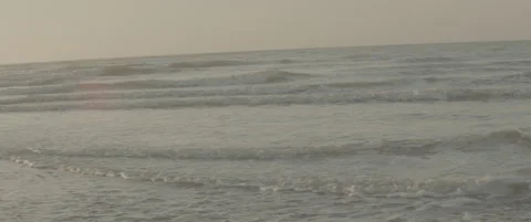 Handheld Mid Shot of Waves Crashing Toward Shore on Suffolk Coast Stock-Footage 320114656
