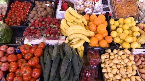 Handheld moving  shoot of various vegetables at stalls Stock Footage 89139525