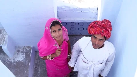 Handheld overhead shot of Beautiful bride and groom waving goodbye from a stairc Video stock 70340651