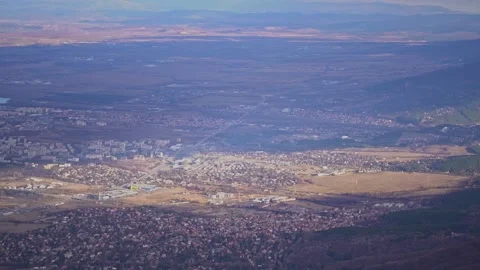 Handheld overview of Sofia city and towns at base of mountains and hills Stock-Footage 236623151