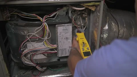 Handheld pan left testing wires HVAC unit handheld tester 4K Stock Footage 202288136