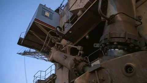 Handheld PAN shot of base and cabin of dragline excavator Stock-Footage 75536634