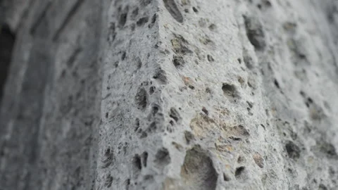 Handheld Pan of Weathered White Stone Wall Corner Detail Stock Footage 315770231
