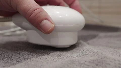 The handheld plastic therapy device is being operated. Stock Footage 320891327