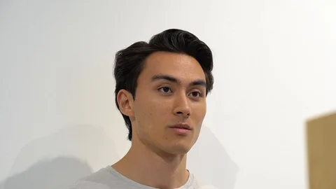 Handheld portrait of handsome man at store Vídeo Stock 114849648
