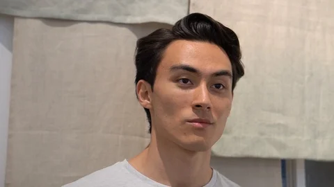 Handheld portrait of handsome man at store Video stock 114849657