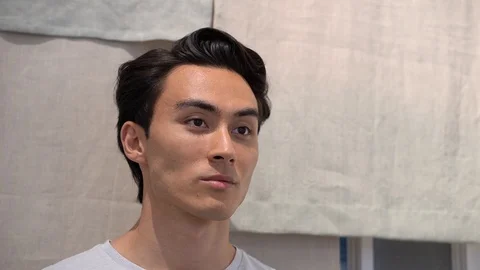 Handheld portrait of handsome man at store Video stock 114849669